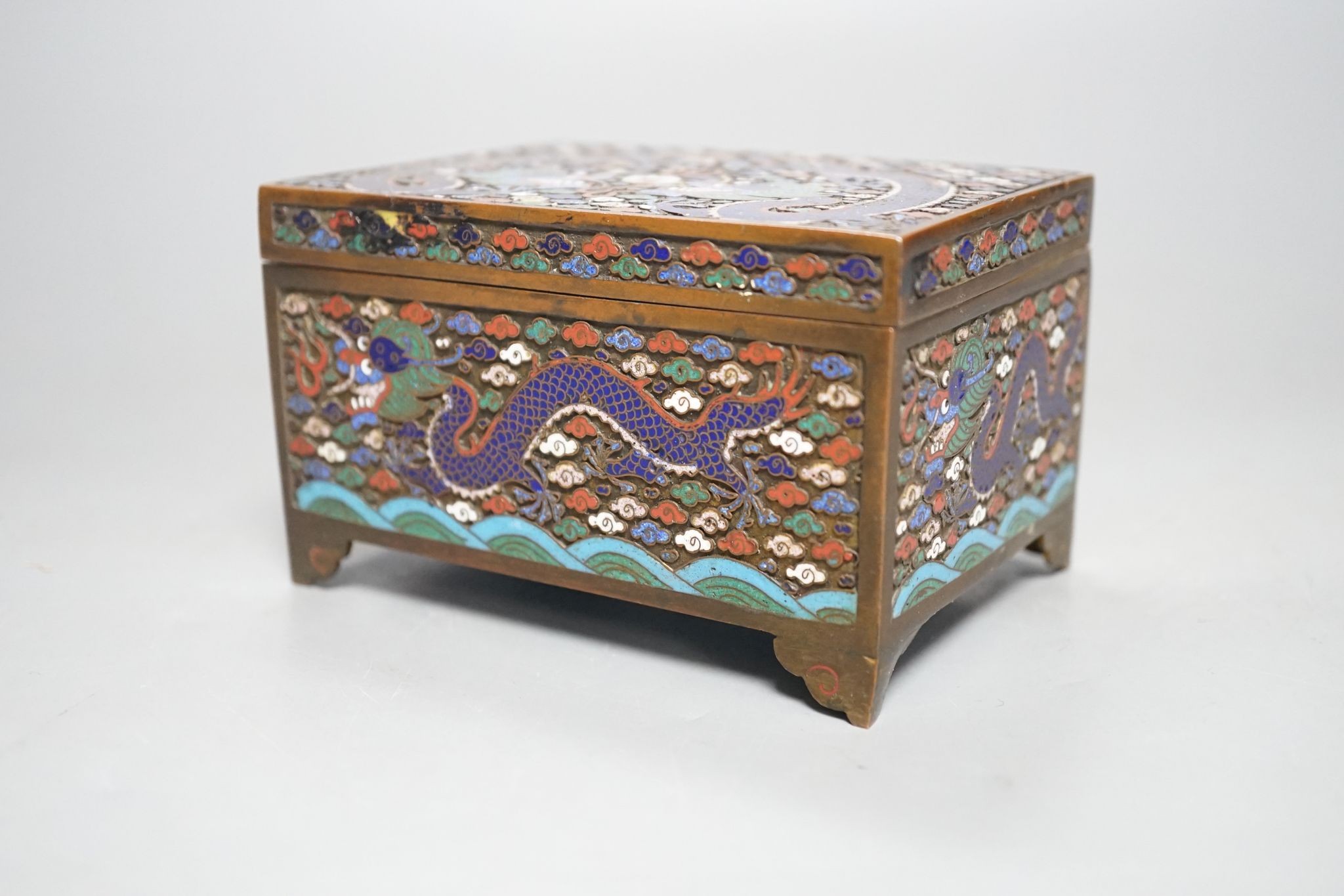 A Chinese bronze and cloisonné enamel ‘dragon’ box and cover, early 20th century, 6 cms high x 11.5 cms wide.
